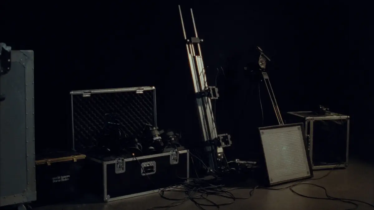Production flight cases, cameras and grip gear staged in the studio before a shoot